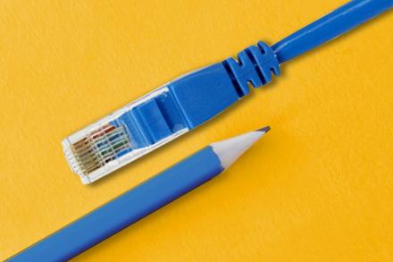 Pencil and LAN cable on yellow background