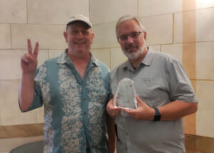 G. Matthew Rice, Executive Director of Linux Professional Institute (LPI), handed the Hall of Fellows Award to Dan York, co-founder of LPI.